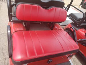 A red seat and back cushion on an electric vehicle.