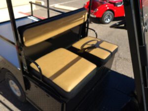A close up of the seats on an electric cart