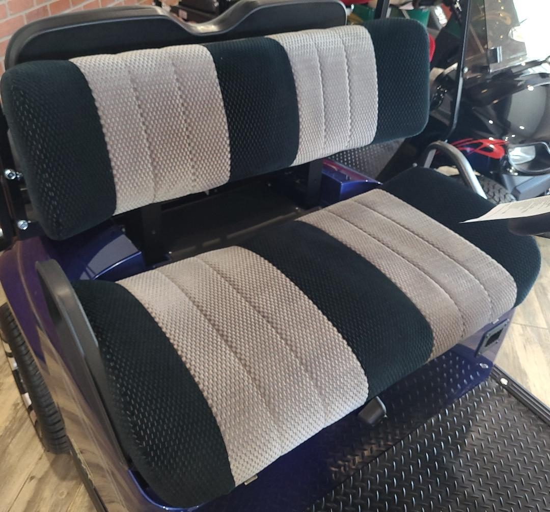 A car seat with two different colored seats.